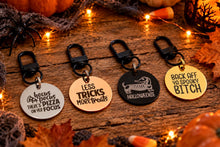 Messi Pups Halloweenie stainless steel pet tag with Halloween-themed design, flat lay showing detailed engraved surface.